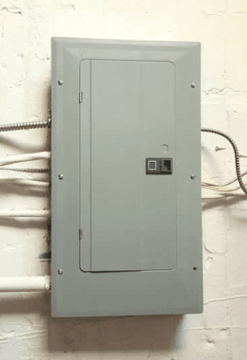 Goodnow Electric technician performing an electrical panel upgrade in a Southern Maine home